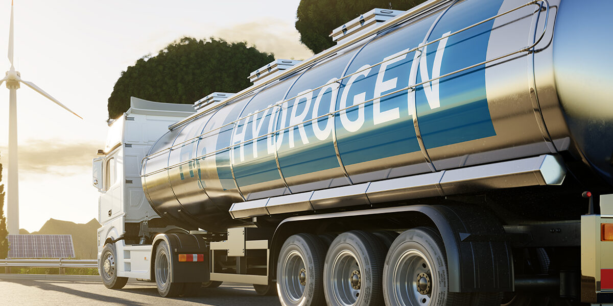 Truck on road with H2 Hydrogen logo. Renewable or sustainable el